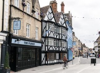 historic building with black and white facade called The Fleece