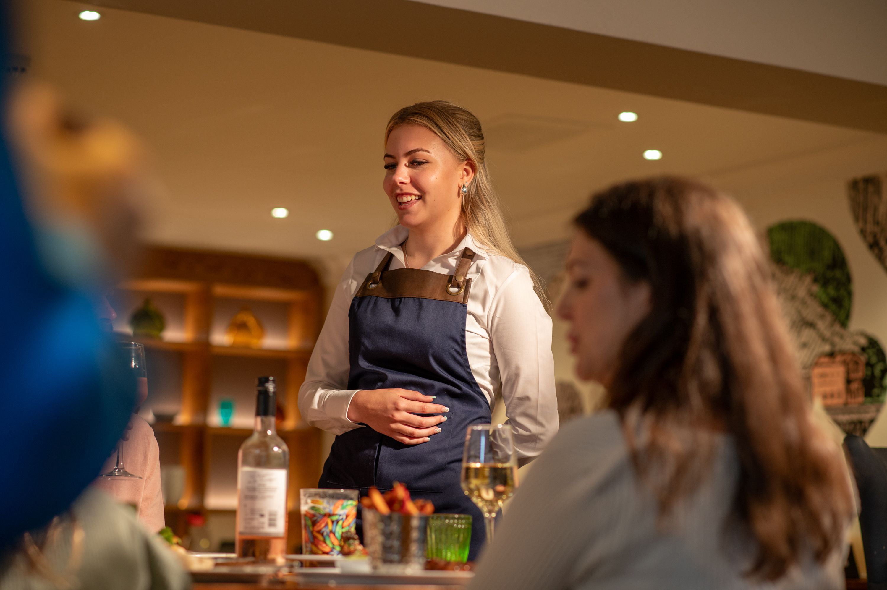 A waitress smiling